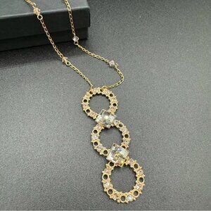 Belladonna Circular Crystal and Gold Tone Infinity Pendant Necklace
